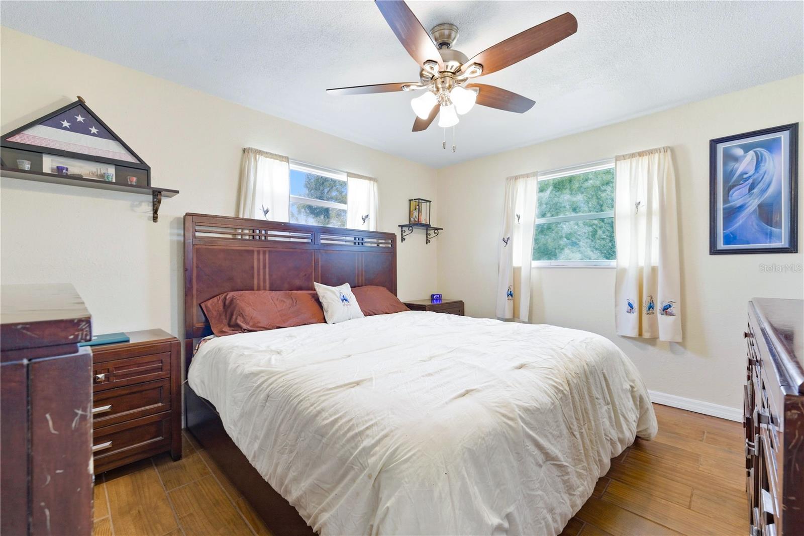 The primary bedroom is spacious with lots of natural light