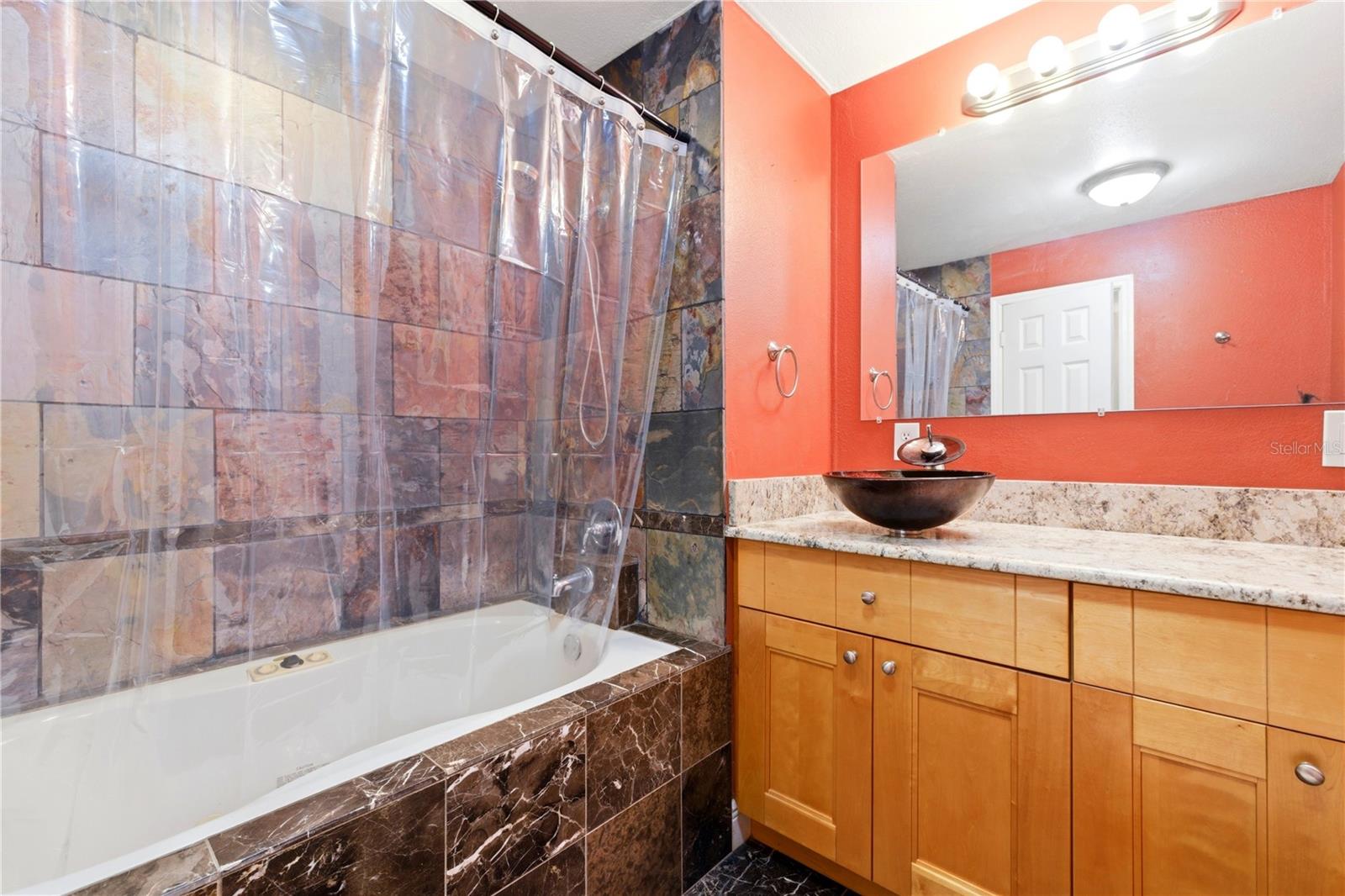 Hallway bath features a soaking tub for ultimate relaxation