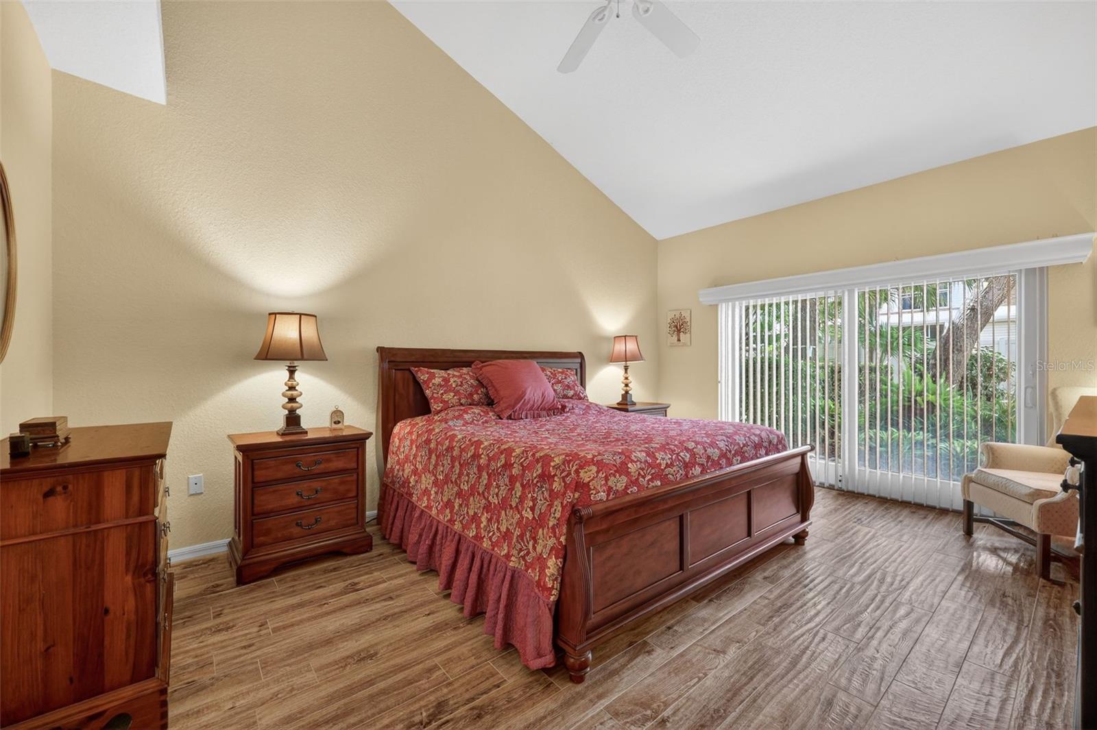 Large Primary w/ Sliding doors to lush yard