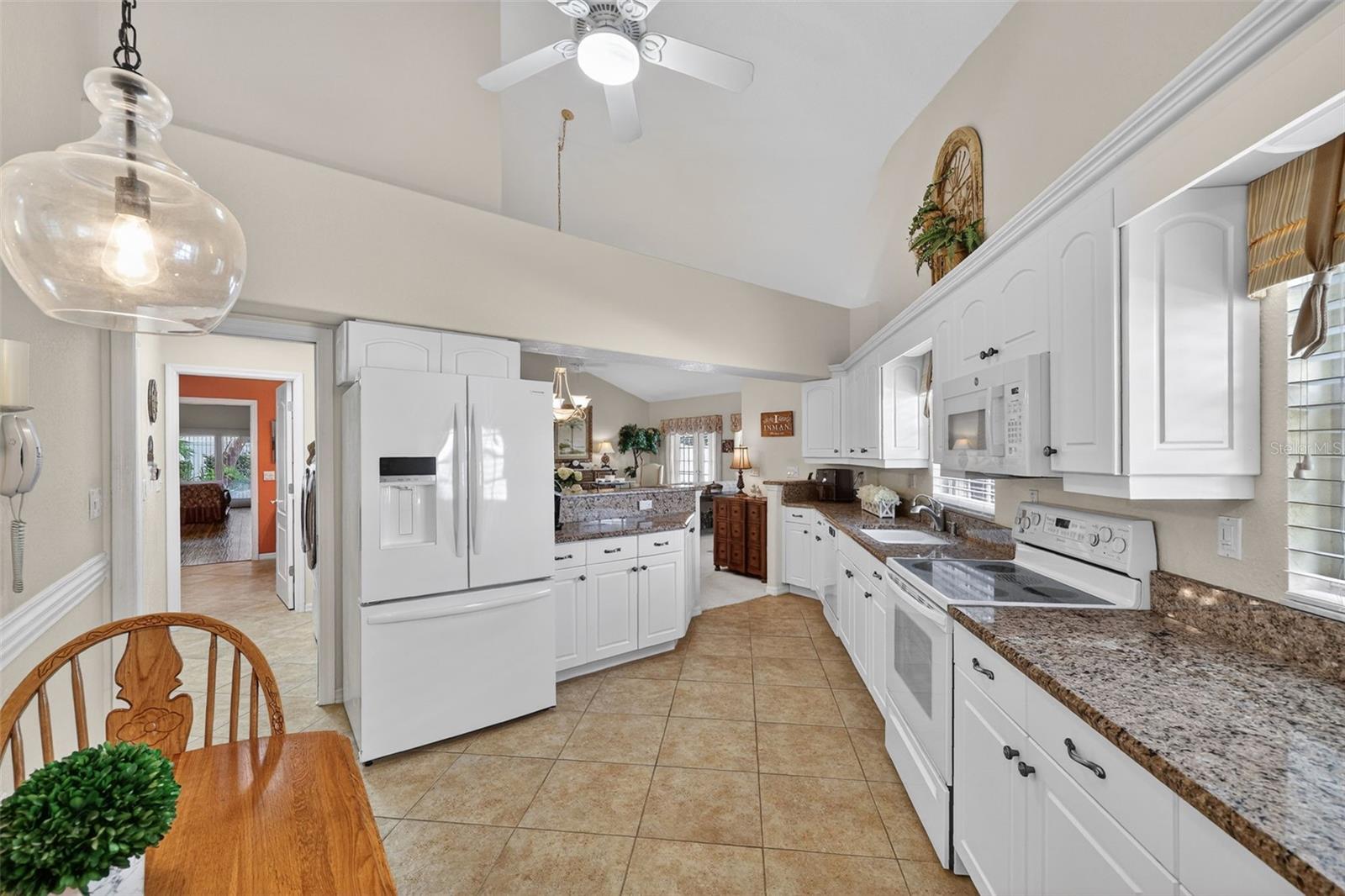 Kitchen/Hallway to Laundry/Primary En Suite