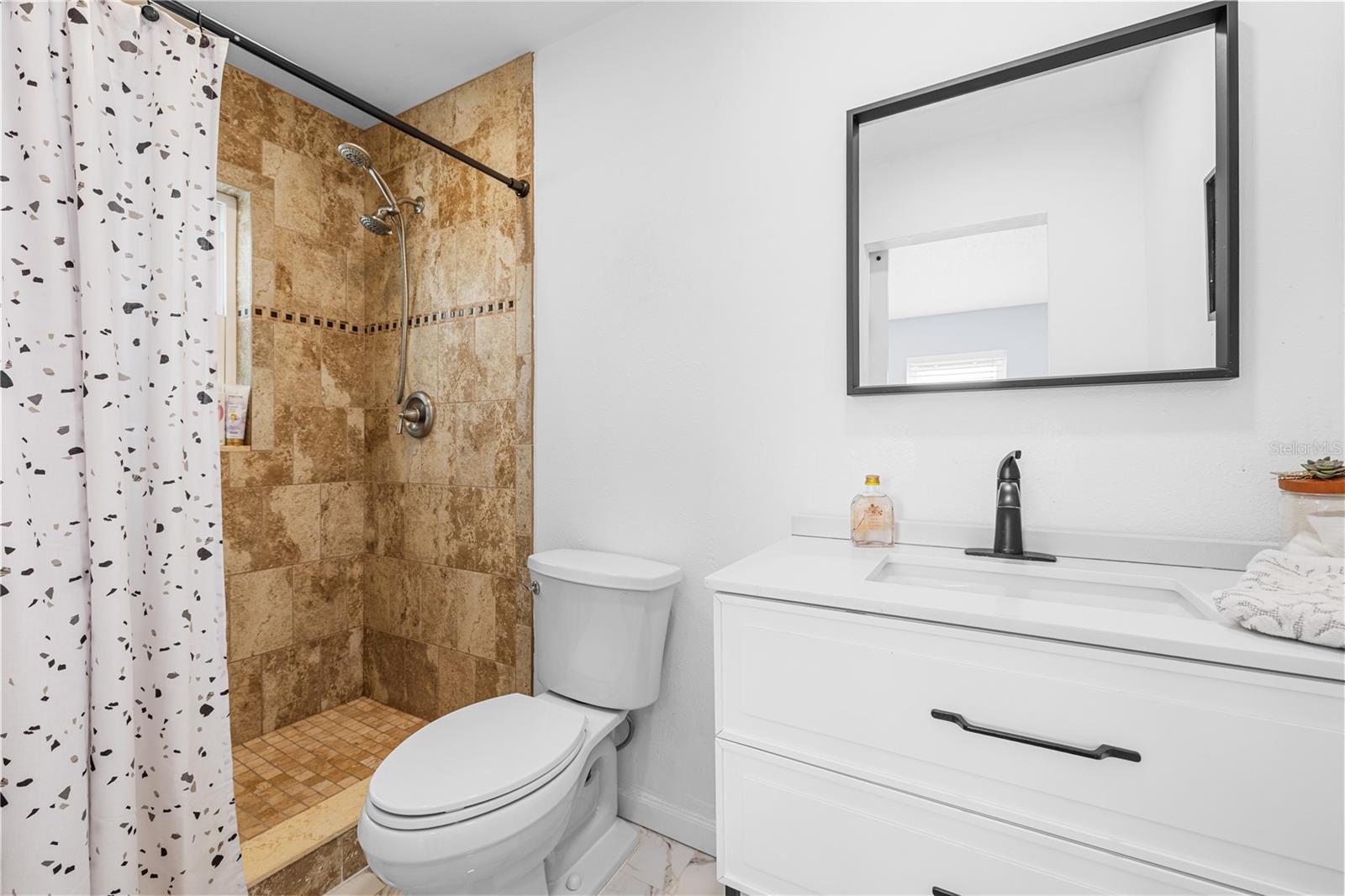 The ensuite bathroom has been tastefully updated