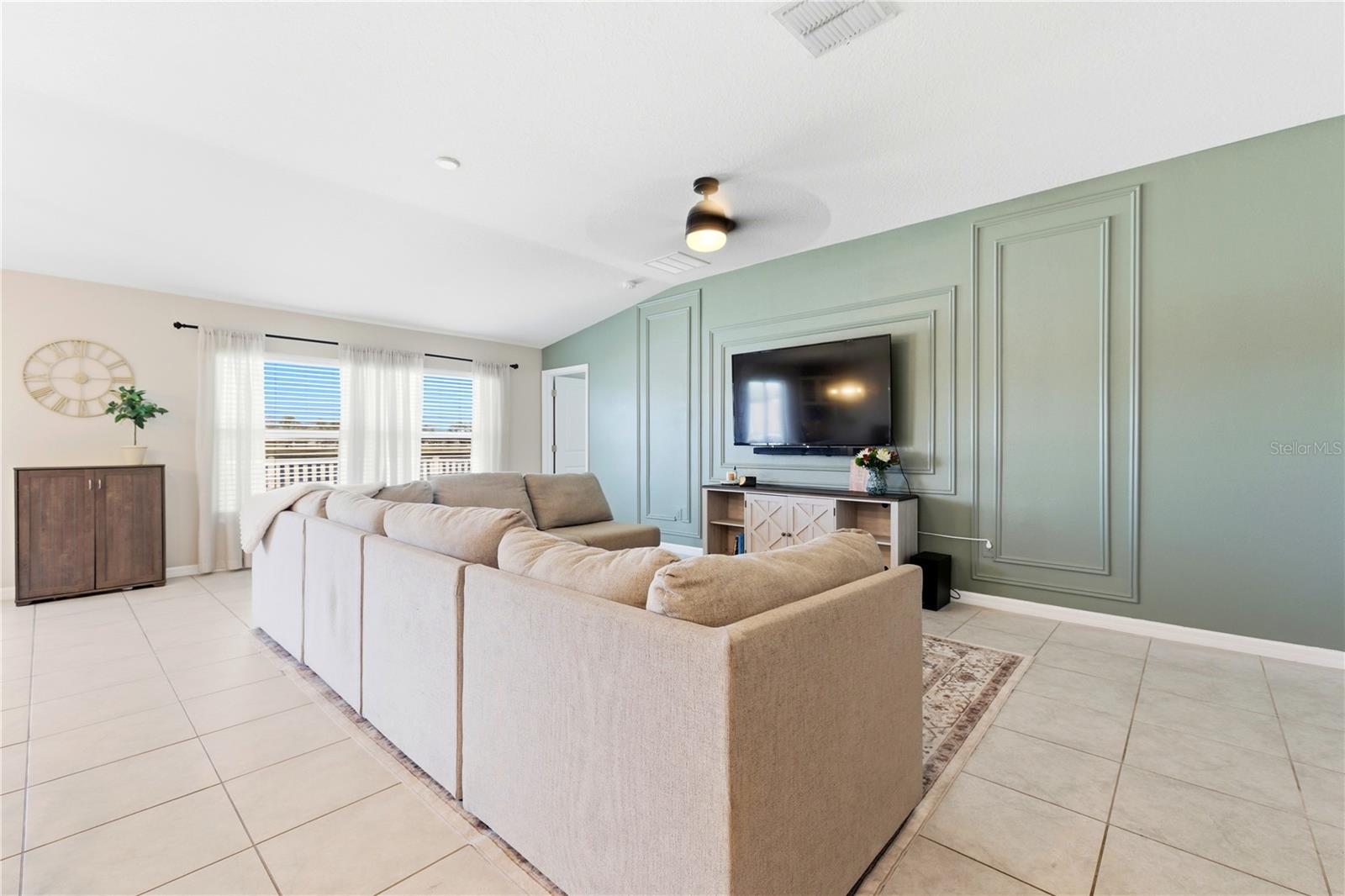 Gorgeous Accent wall adds a modern touch with plenty of room for your entertainment