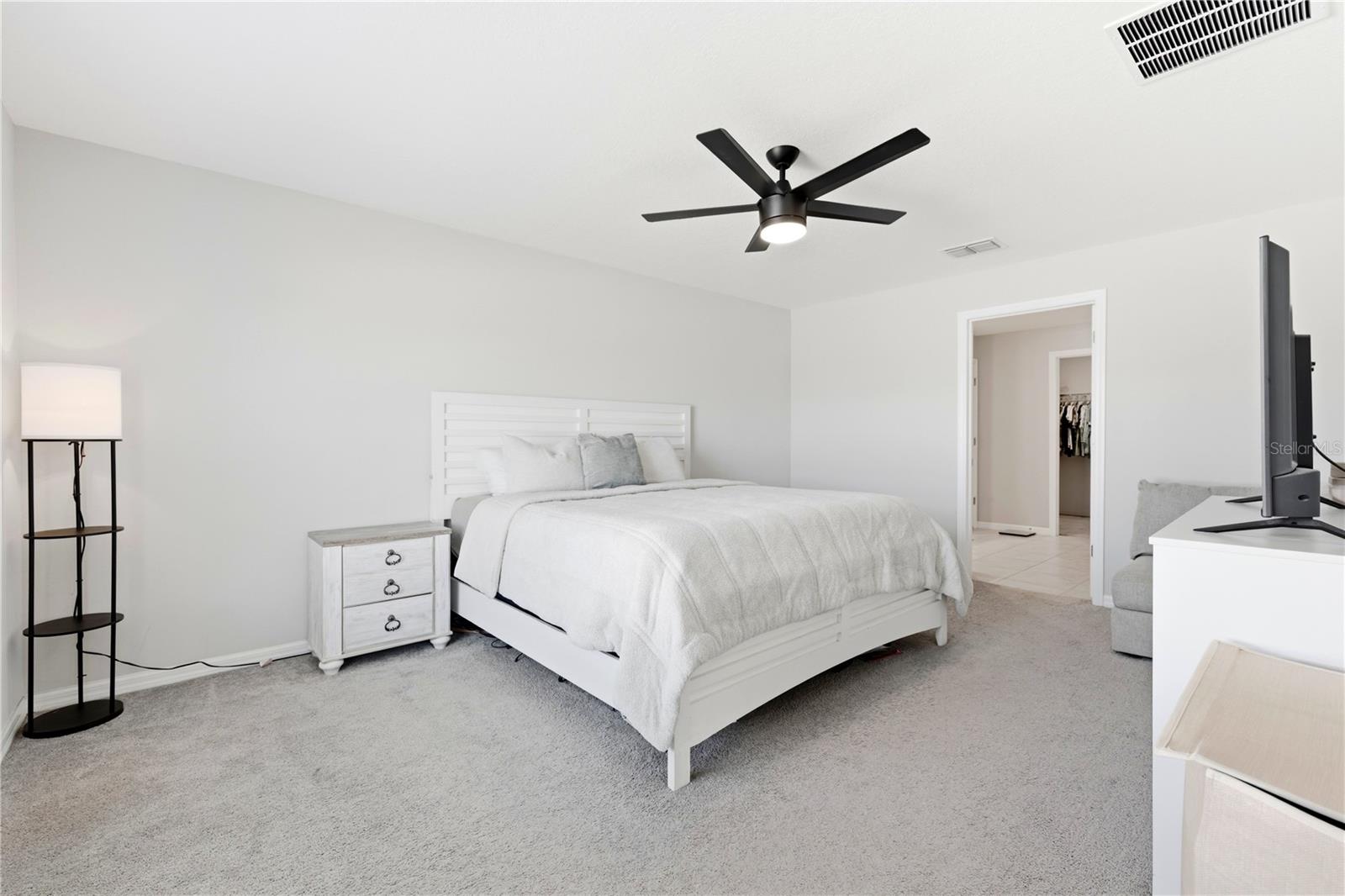 Spacious primary bedroom offers