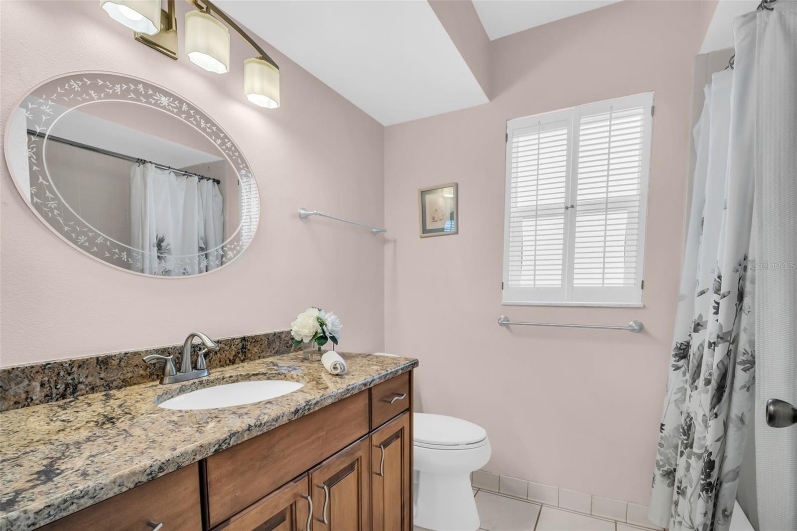 Updated hall bath with granite countertops & lighting~