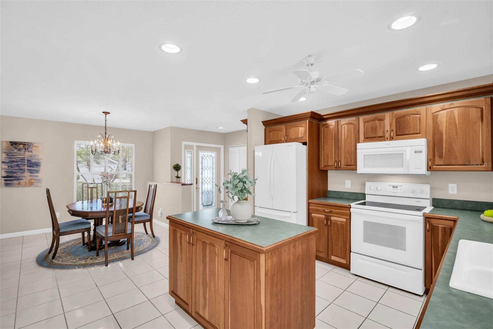 Beautiful kitchen with updated cabinetry & perfectly open to the dining room & main living~