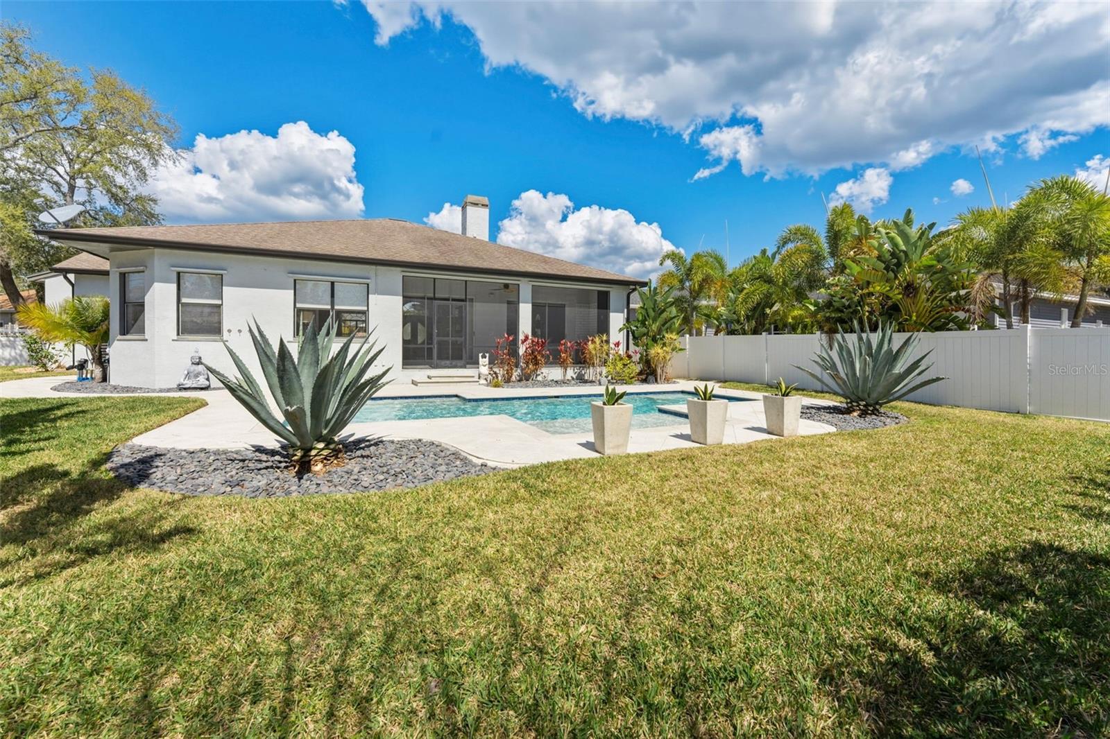 Rear Exterior with Lawn and Landscaping