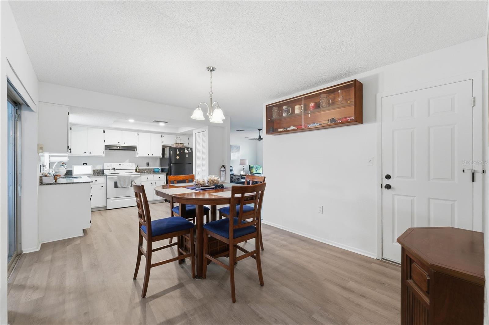 Dining and kitchen from guest bathroom door