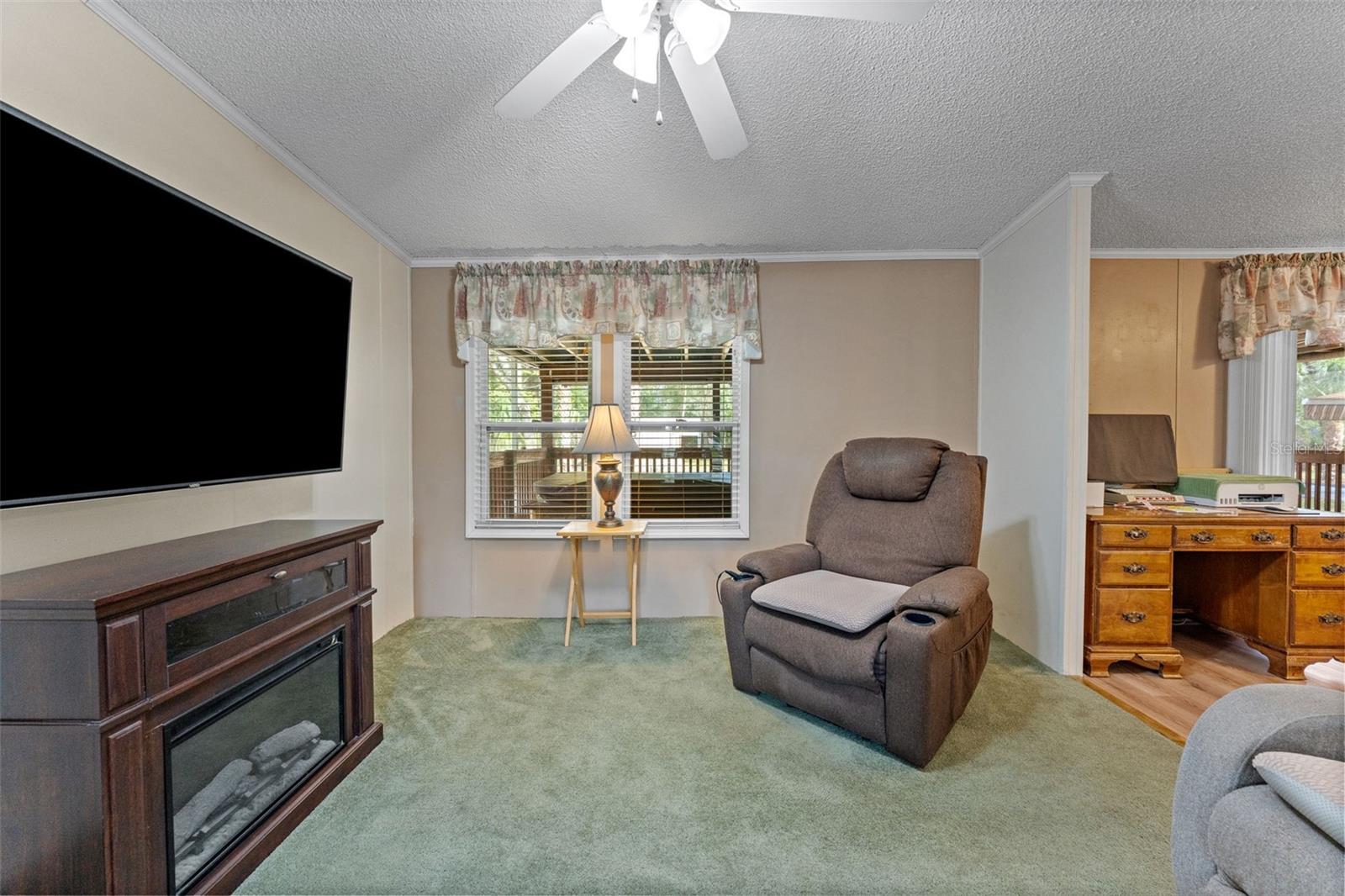 Living Room with Natural Light and a Ceiling Fan