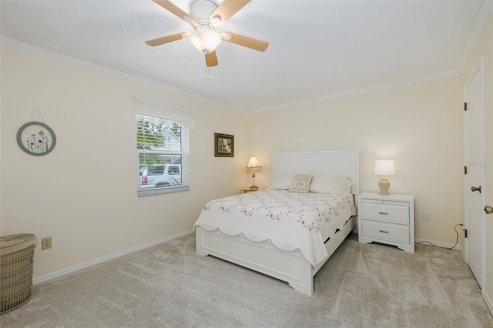 Primary bedroom with walk in closet and en suite bath