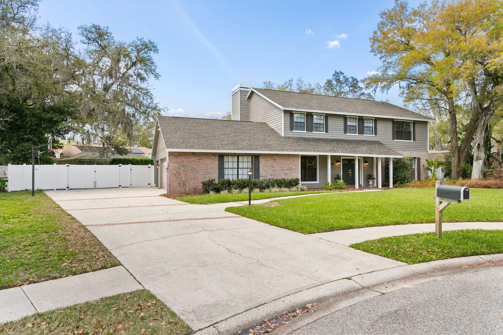 Long Spacious Driveway with Basketball Hoop