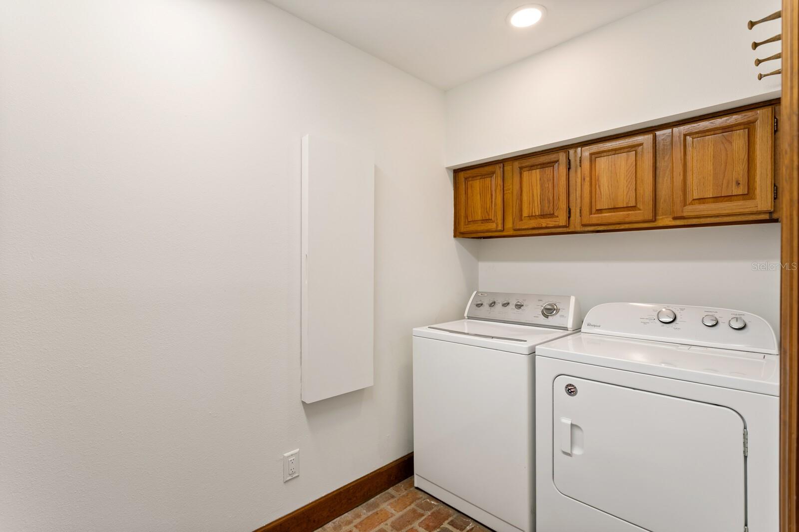 Laundry Room with Walk-In Storage Closet next to Kitchen
