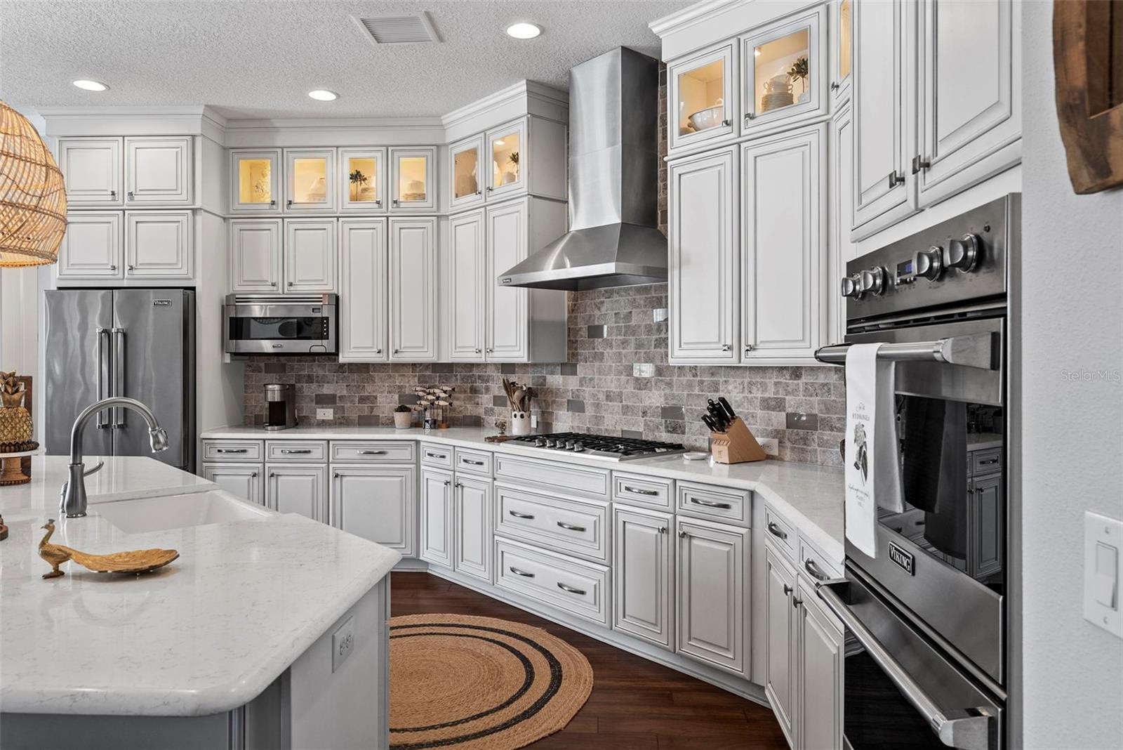 Kitchen with Viking appliances, soft close drawers, double ovens , farm sink, quartz  countertops