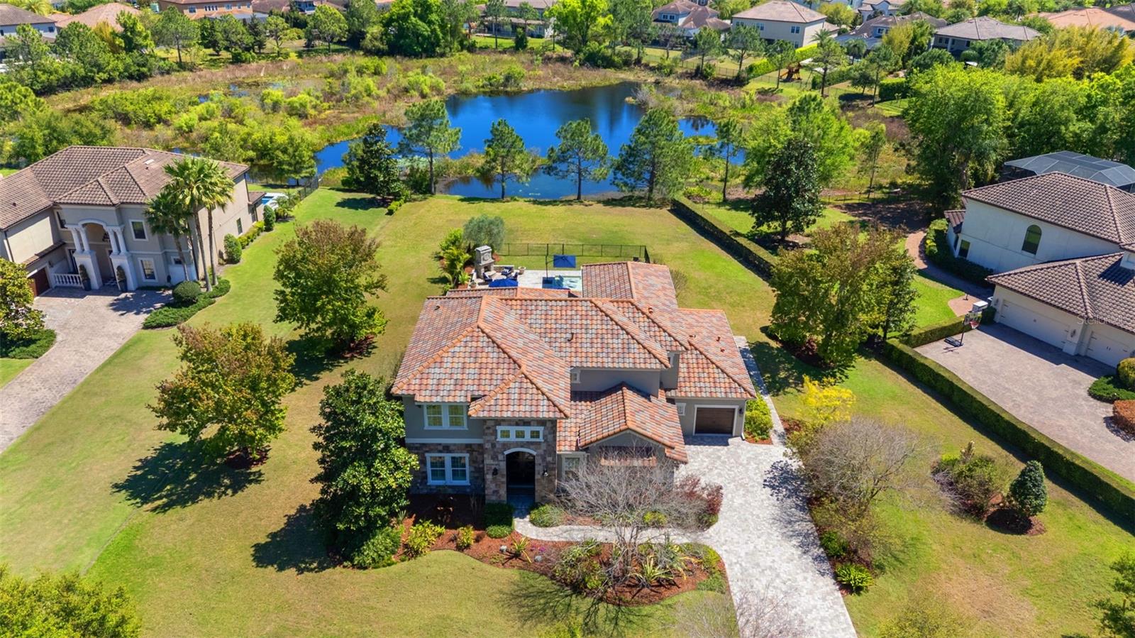 Situated on .79 acres- in the gated community of Old Memorial