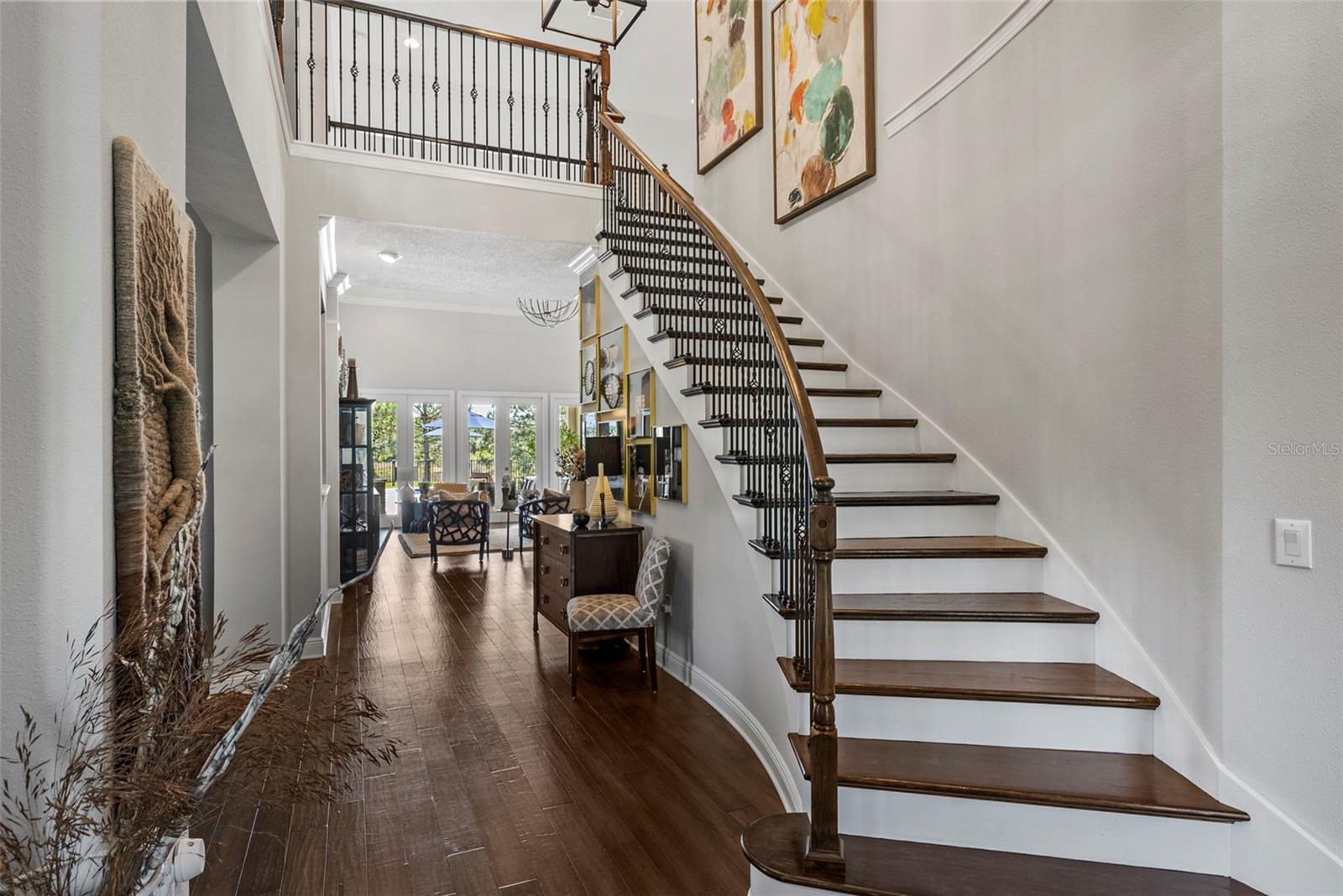 The foyer greets you with 20 ft ceilings and a bridal staircase