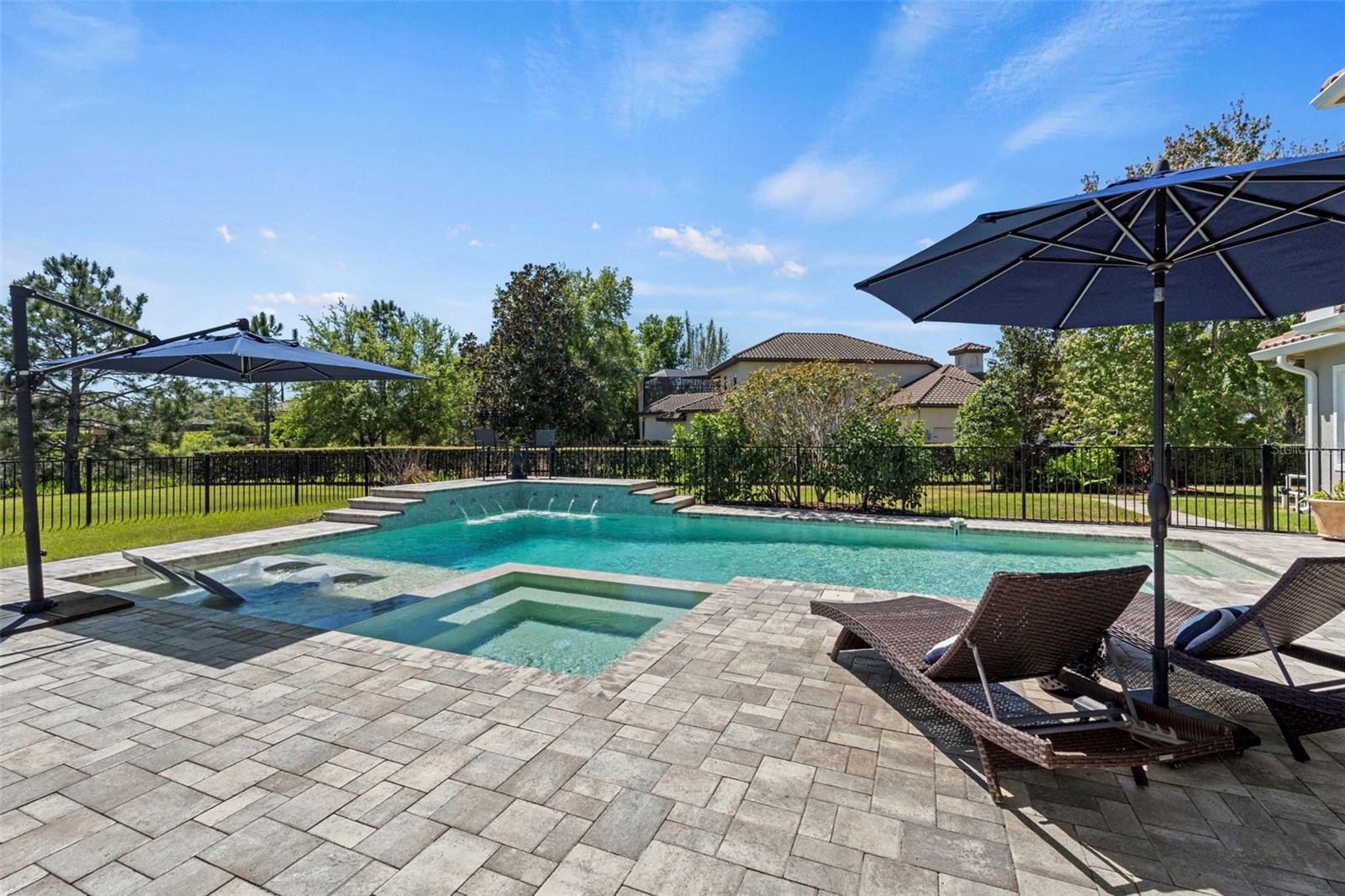Open air heated pool and spa with gas remote control fireplace- Fully fenced pool area