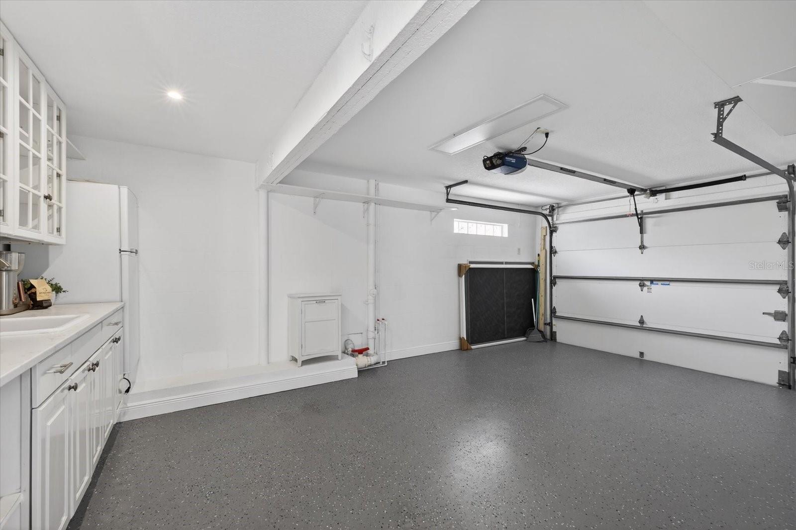 Garage on east side of home showing kitchenette-easily add a murphy bed for extra sleeping space