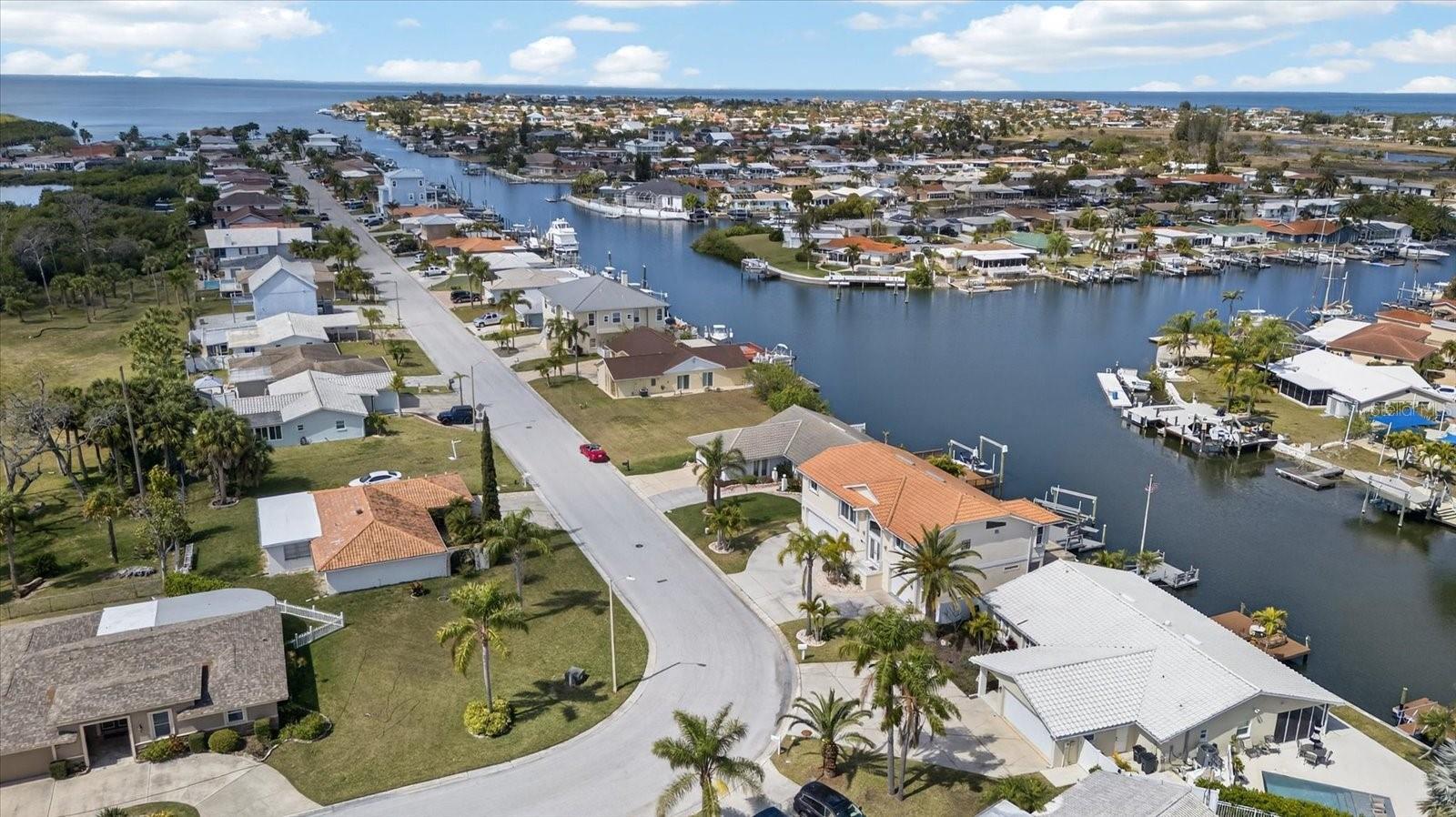 Aerial shows Quick, Direct DEEP Water GULF access-Street and canal views of home's ideal location