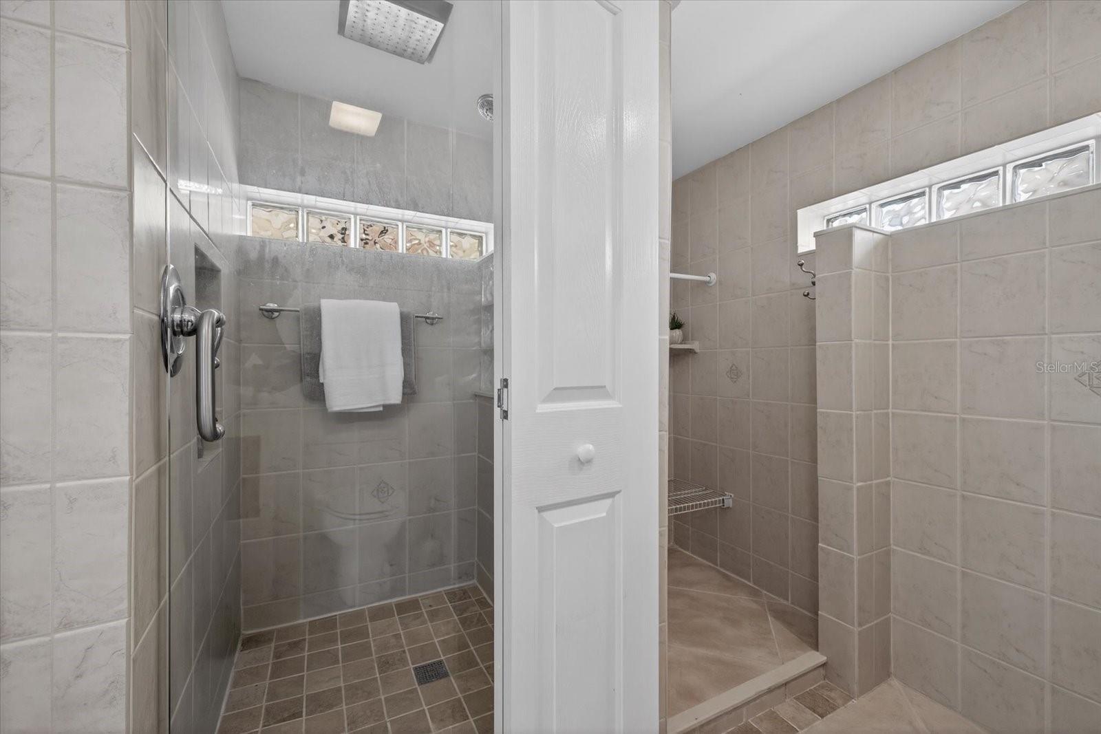 View of lower level shower and linen closet