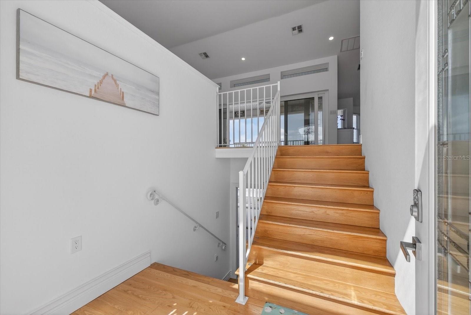 View from Front Door landing of hardwood stairs.