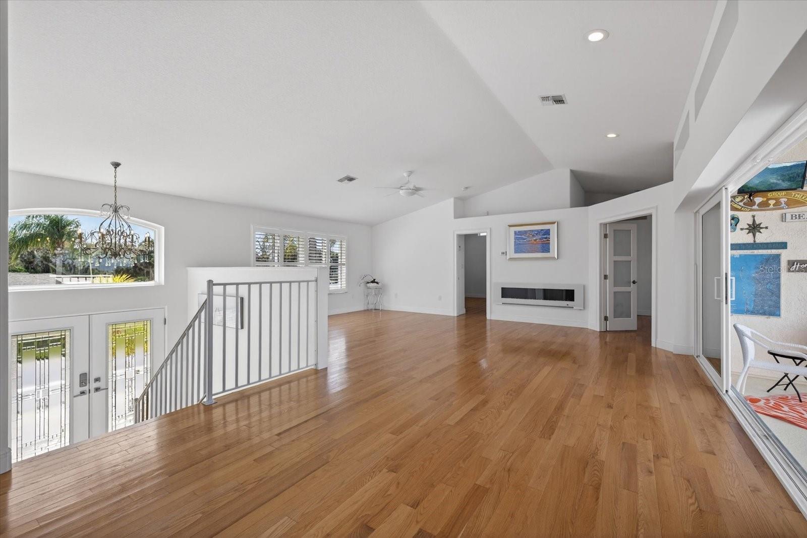 Great Room upstairs looking west, Vaulted ceilings and sliders to balcony