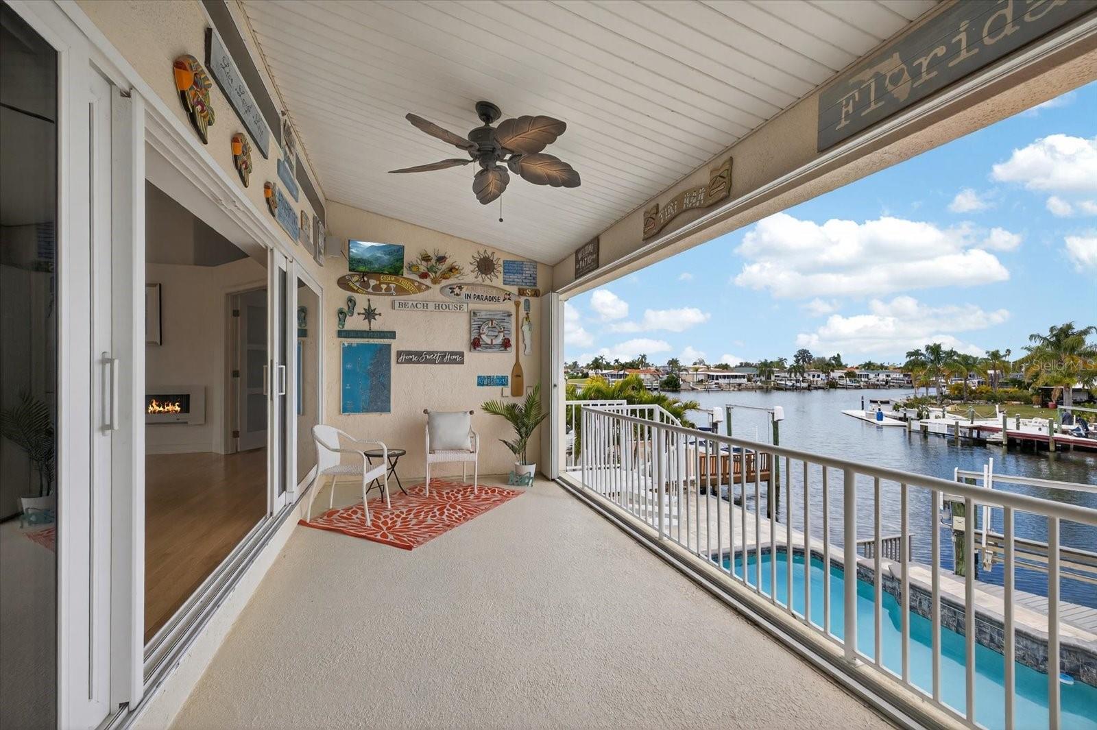 Upstairs balcony patio with views of pool and Gulf.