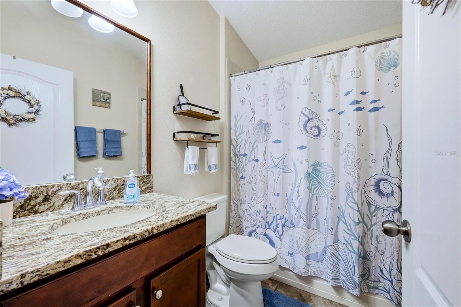 Guest bath with tub/shower enclosure