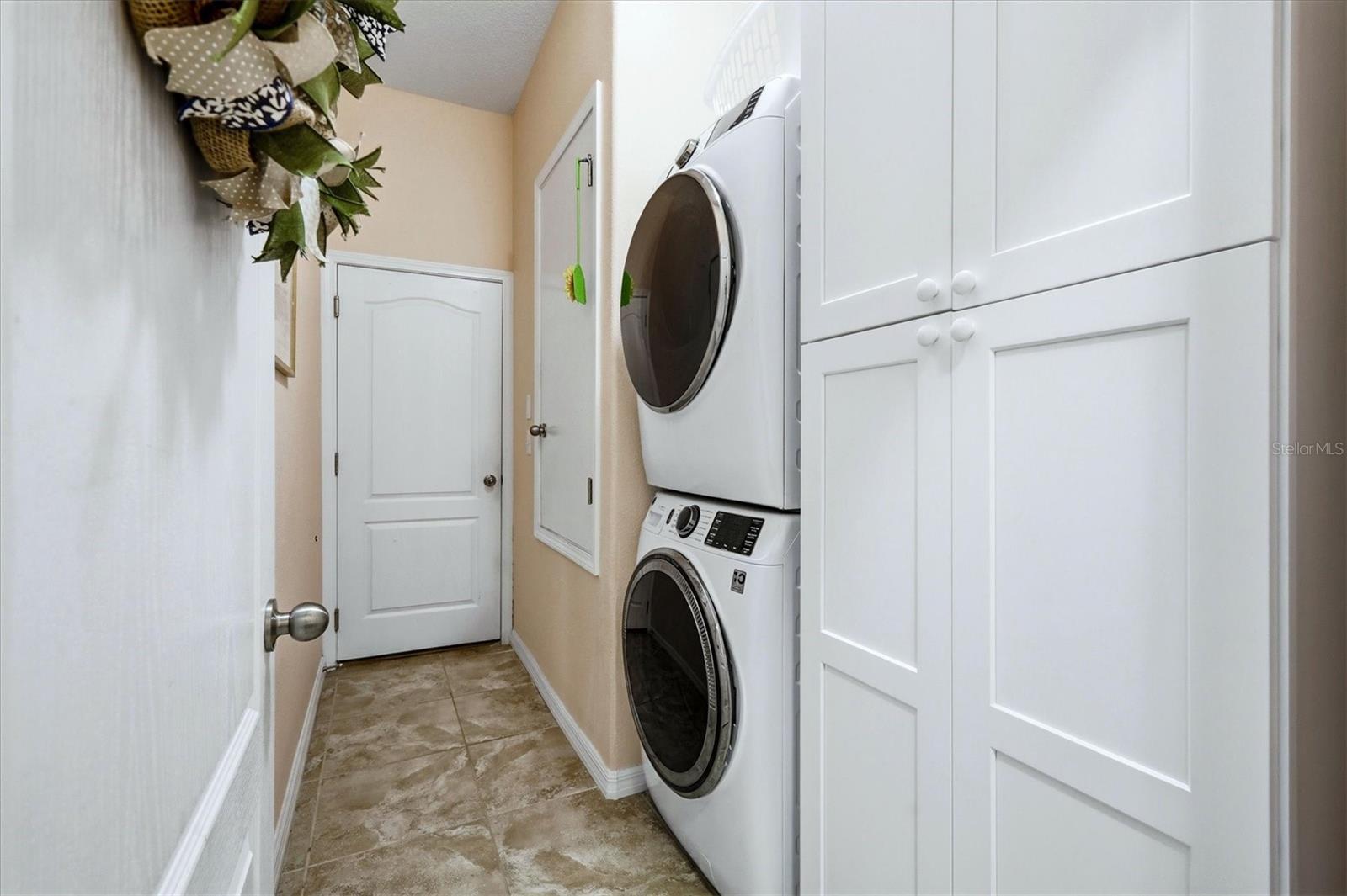 Laundry room with full-size stacking w/d