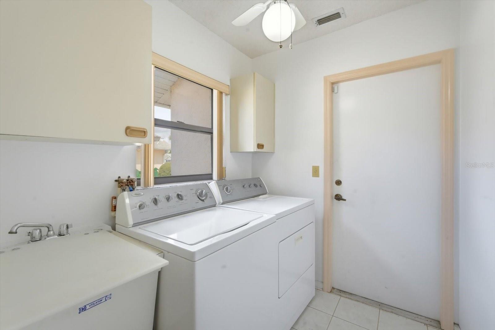 laundry room with utility sink (and folding board)
