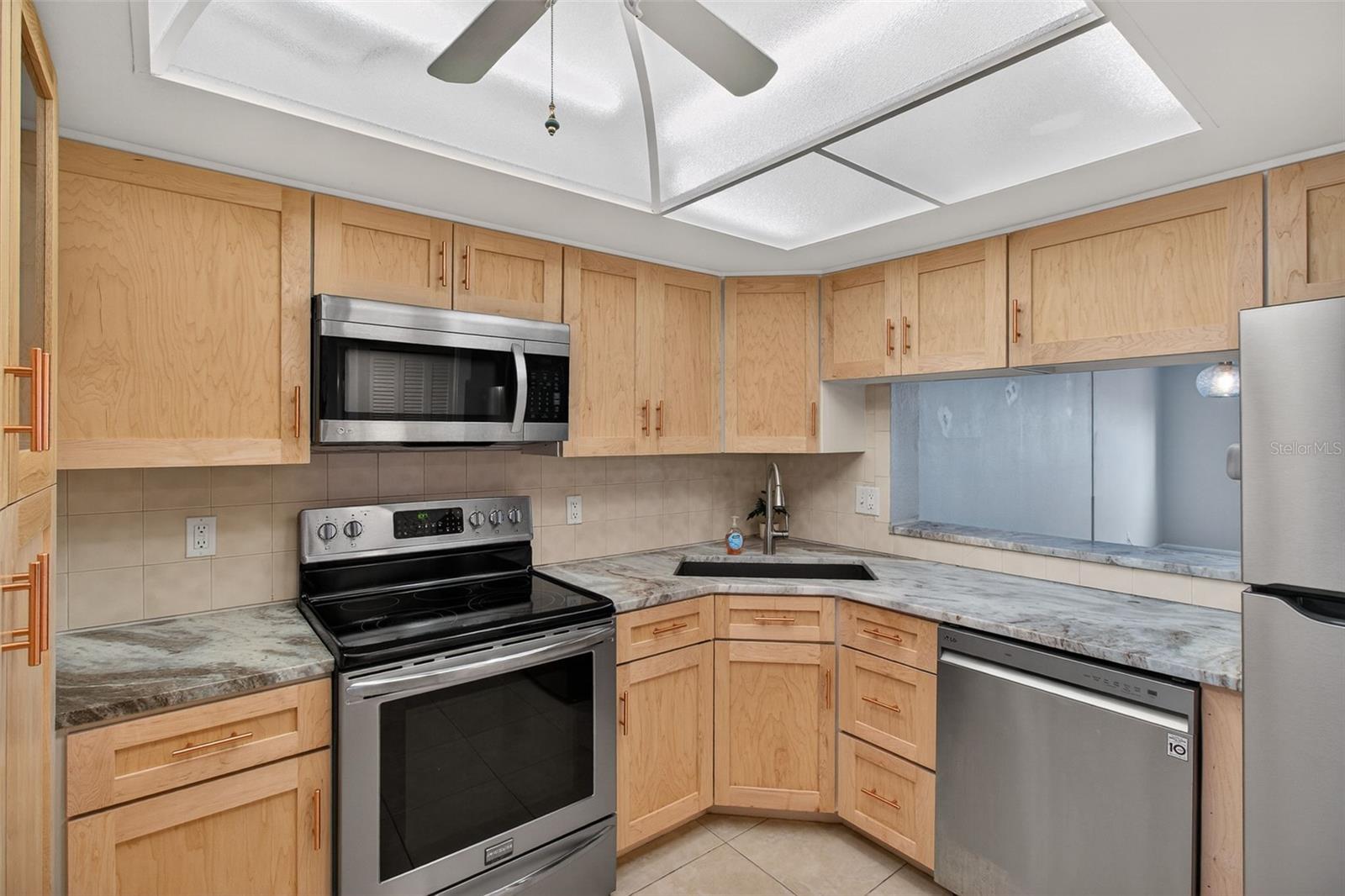 Kitchen with new stainless steel appliances and quartz counter tops