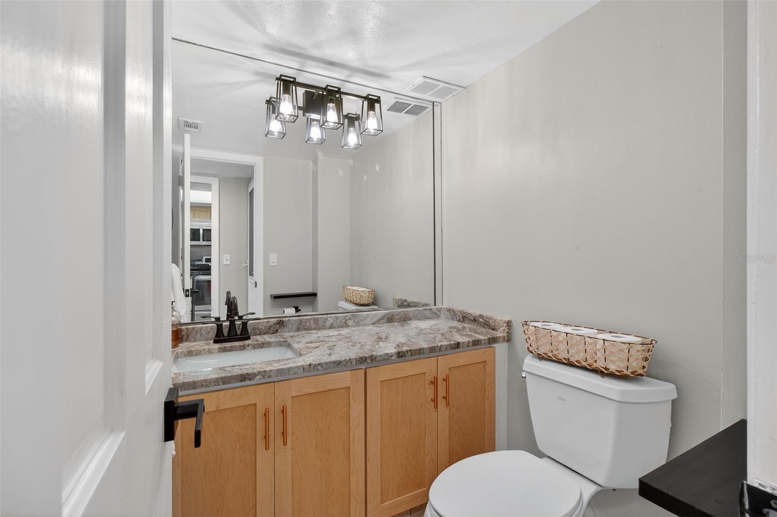 1/2 bathroom with new quartz counter top.
