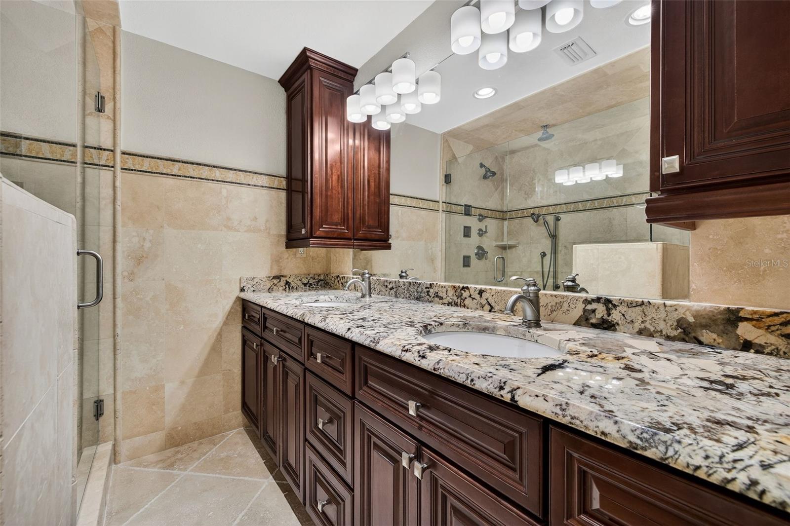 Dual granite vanities. Six shower heads