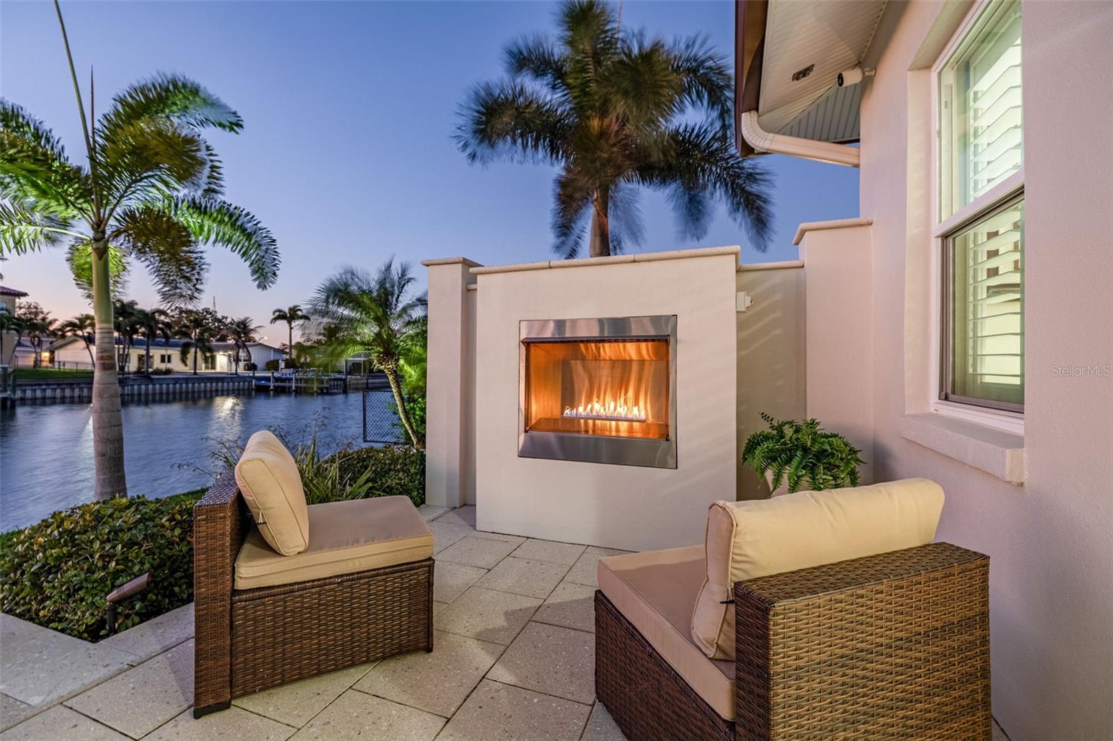 Outdoor living area with gas fireplace.