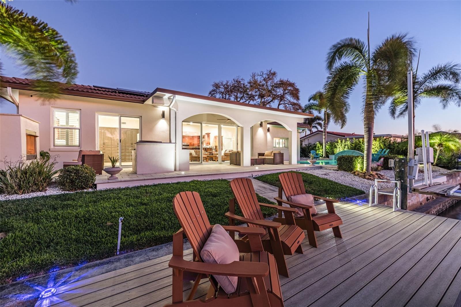 Additional sitting area on Dock with 20,000lb boat lift and jet ski lift.