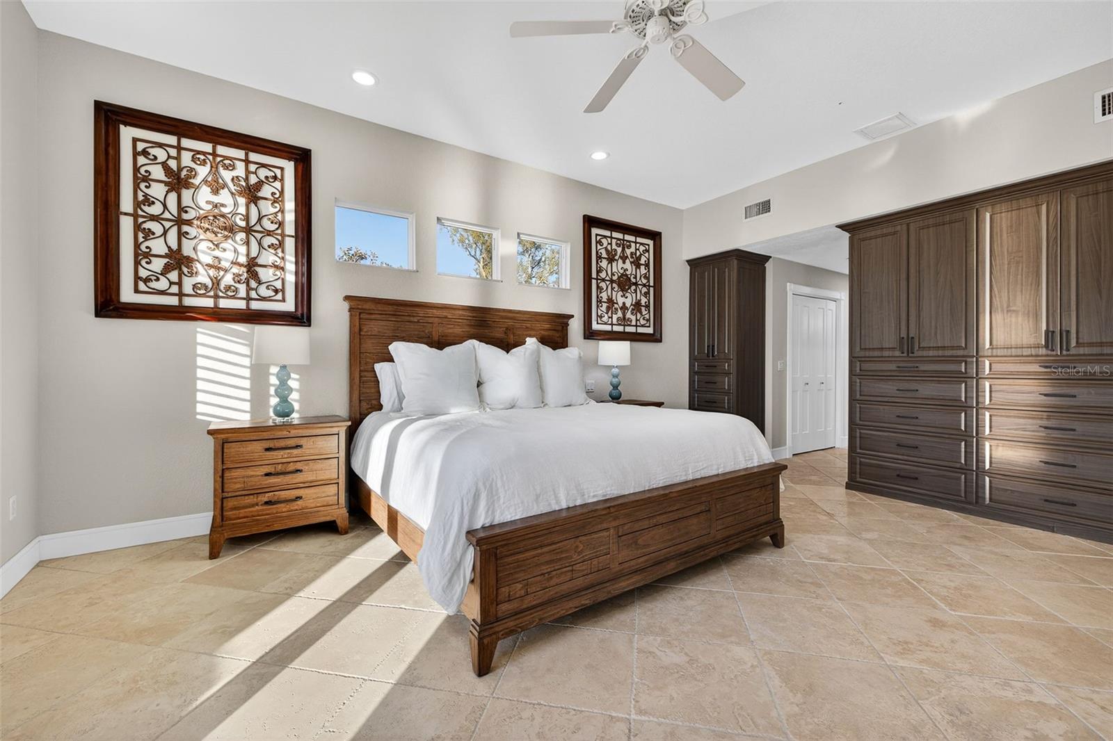Primary Bedroom with built-in wardrobe.