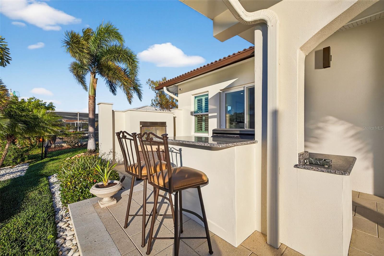 Outdoor kitchen area/ bar area for eating.