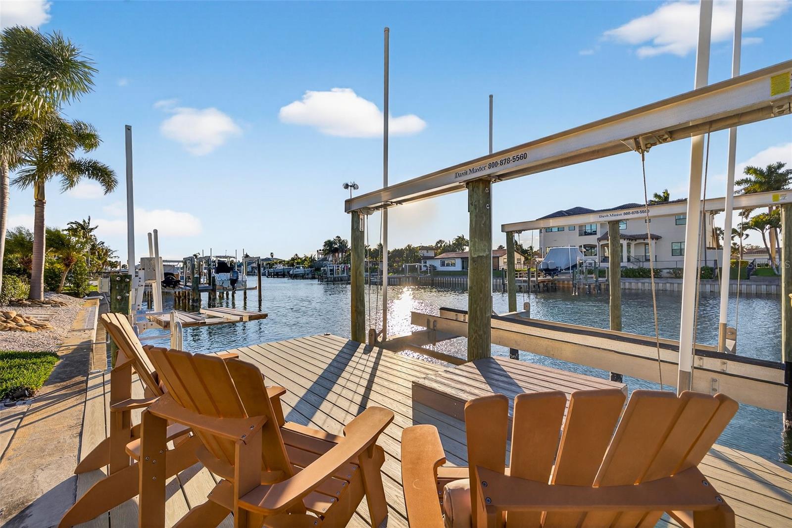 Additional sitting area on Dock with 20,000lb boat lift and jet ski lift. Equipped with electrical and water.