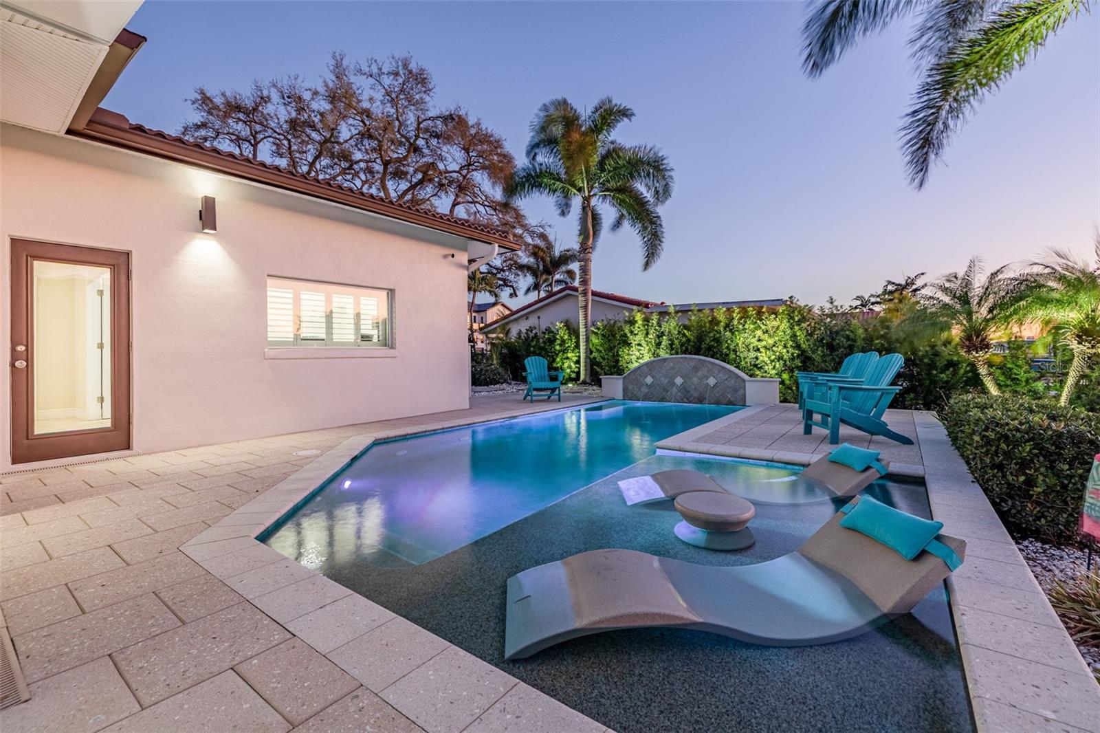 Saltwater pool with swim jets, programmable and customizable  LED lights, automatic pool filler, water feature and sun deck. Pre-plumbed for a heater.