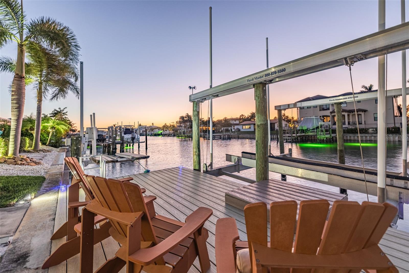 Additional sitting area on Dock with 20,000lb boat lift and jet ski lift. Equipped with electrical and water.