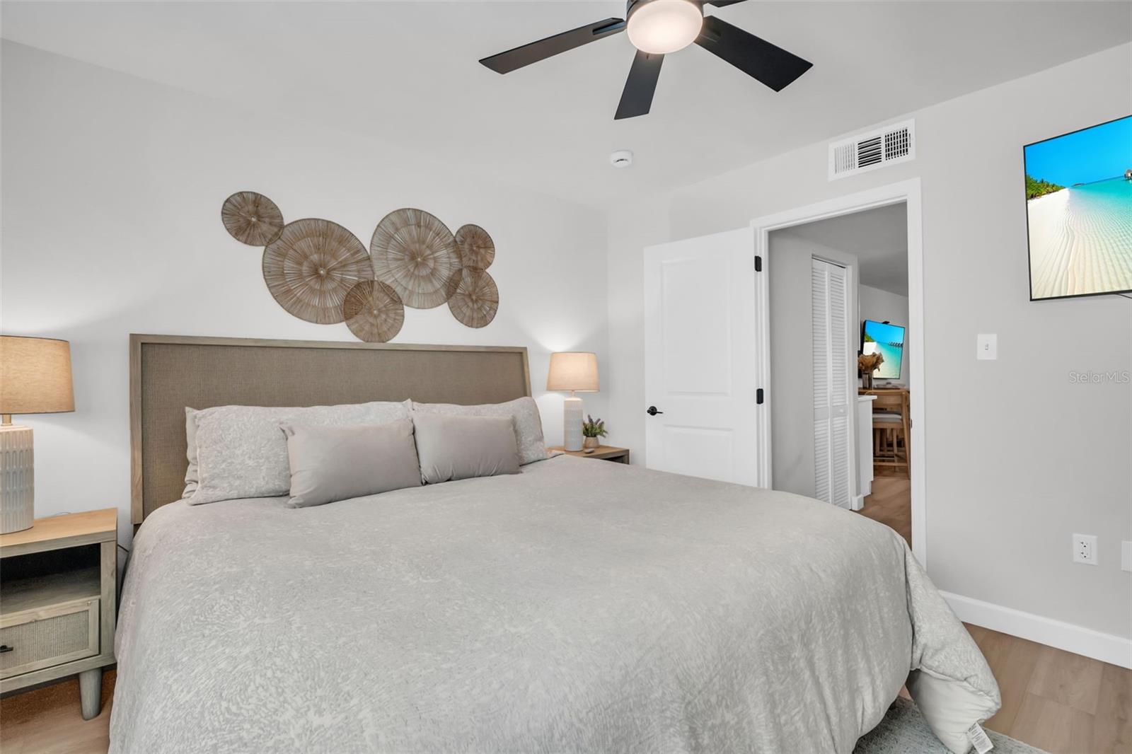 Thoughtfully designed for comfort, this bedroom offers a peaceful oasis with curated decor and luxurious textures.