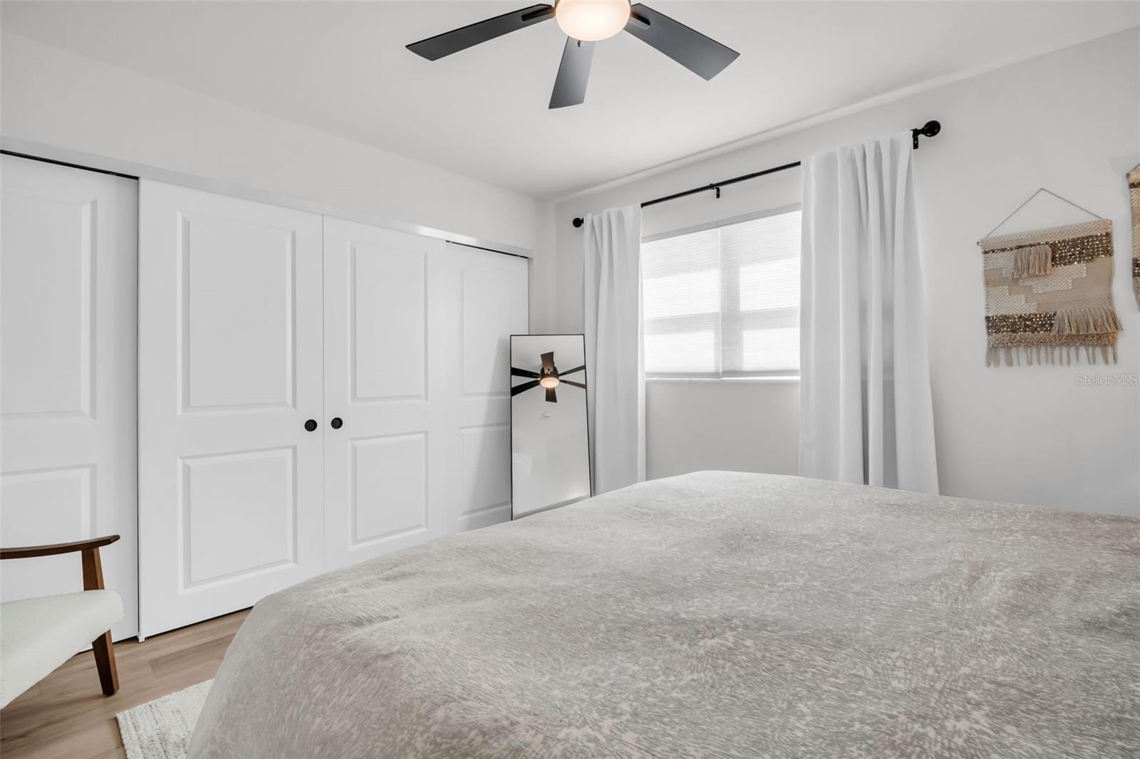 The master suite features a custom-built closet system, offering tailored organization with dedicated shelvings and hanging spaces.