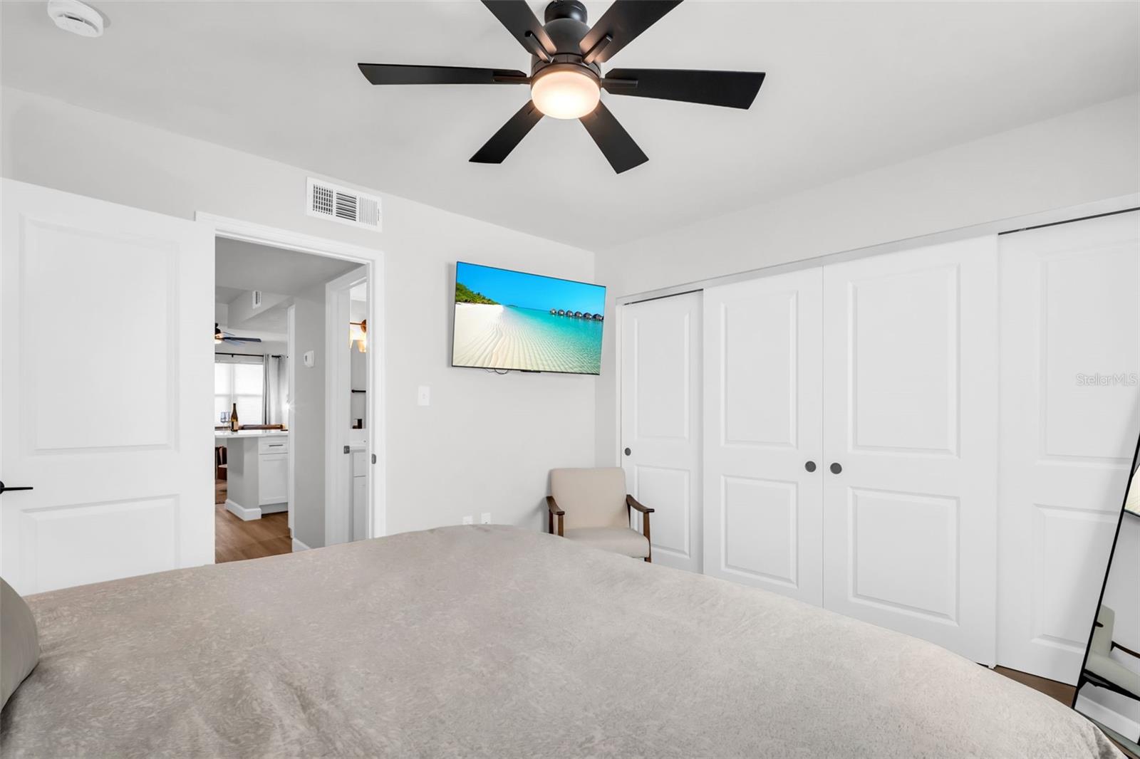 Unwind in comfort with a mounted flat-screen TV in the master suite.