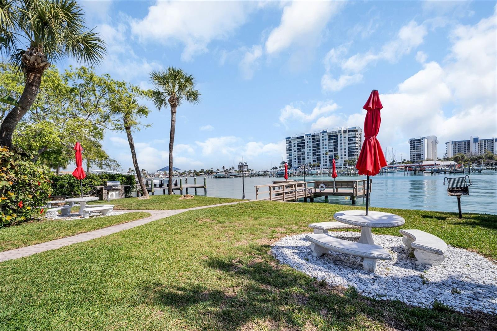 Your private waterfront picnic spot. The ultimate 'grill and chill' spot, featuring a, shady umbrella and direct access to the dock.