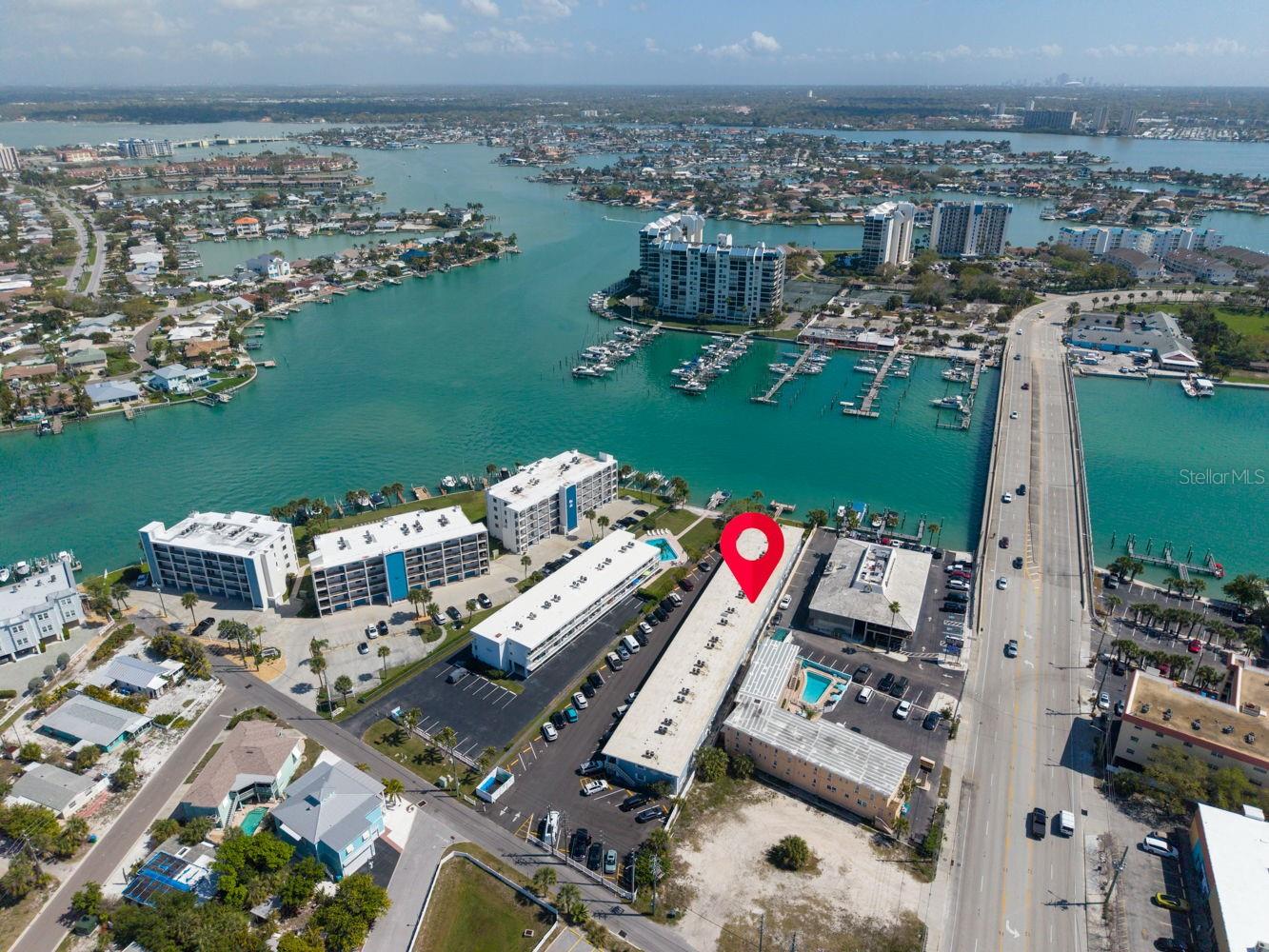 This wider shot places the property in context with nearby attractions, showcasing the privacy of the lot while highlighting proximity to key, desirable amenities.