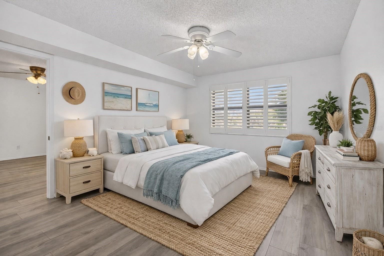 Primary bedroom with ensuite bathroom and walk in closet.