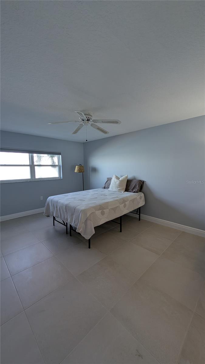 Expansive Primary Suite with New 18x18  luxury tile upgrade and 6 inch base boards feels 5 star!