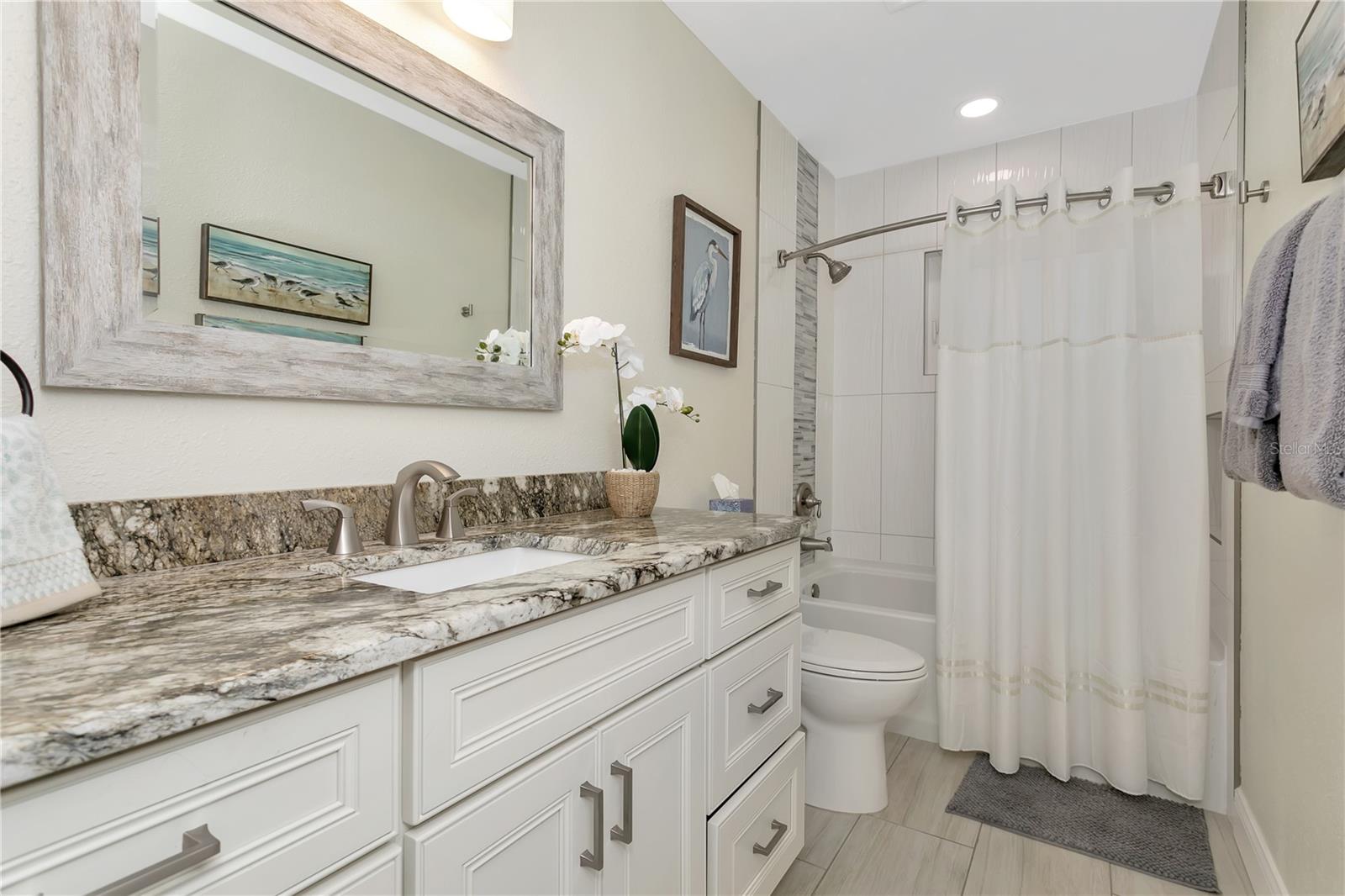 Hallway bathroom with tub/shower combo