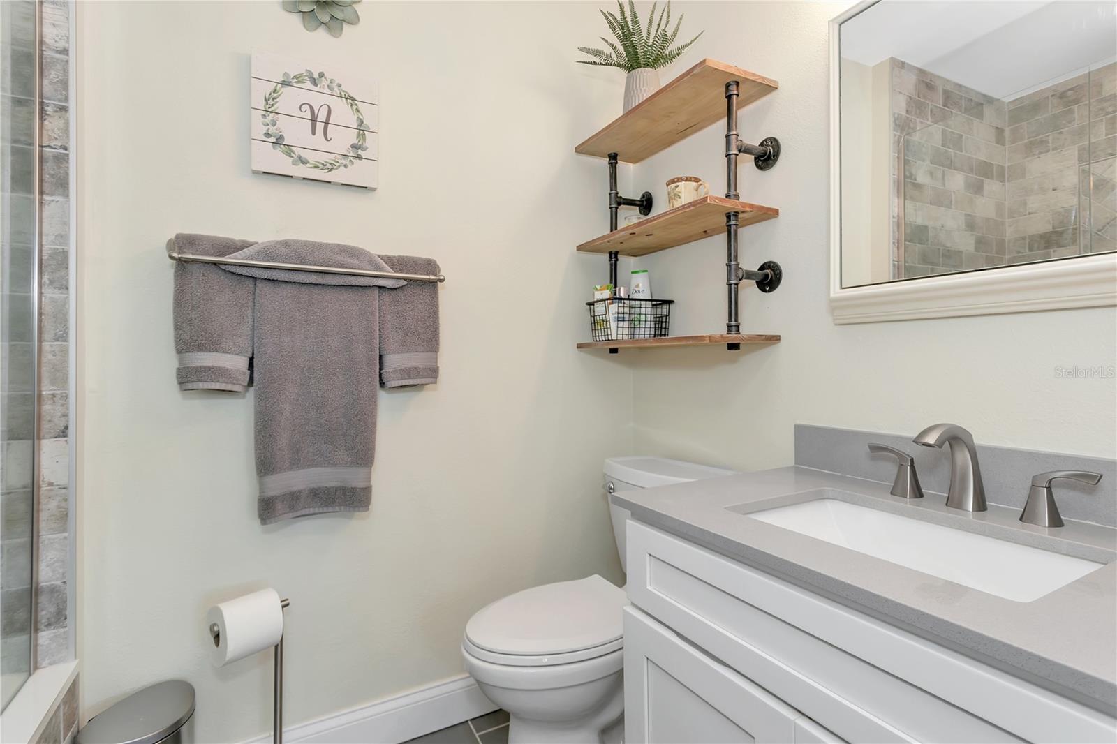 Modern bathroom located in second primary bedroom