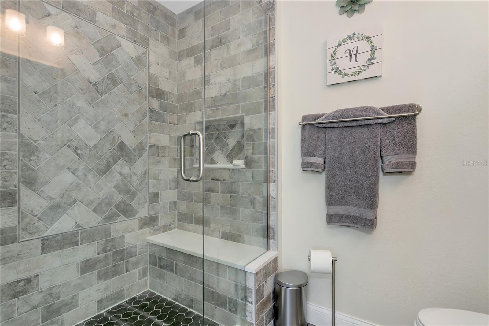 Modern bathroom located in second primary bedroom