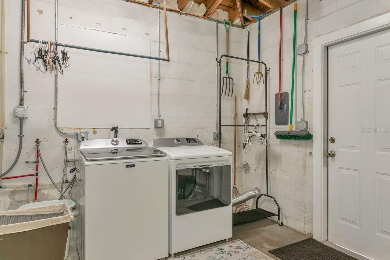 Newer washer and dryer located in garage convey with the home
