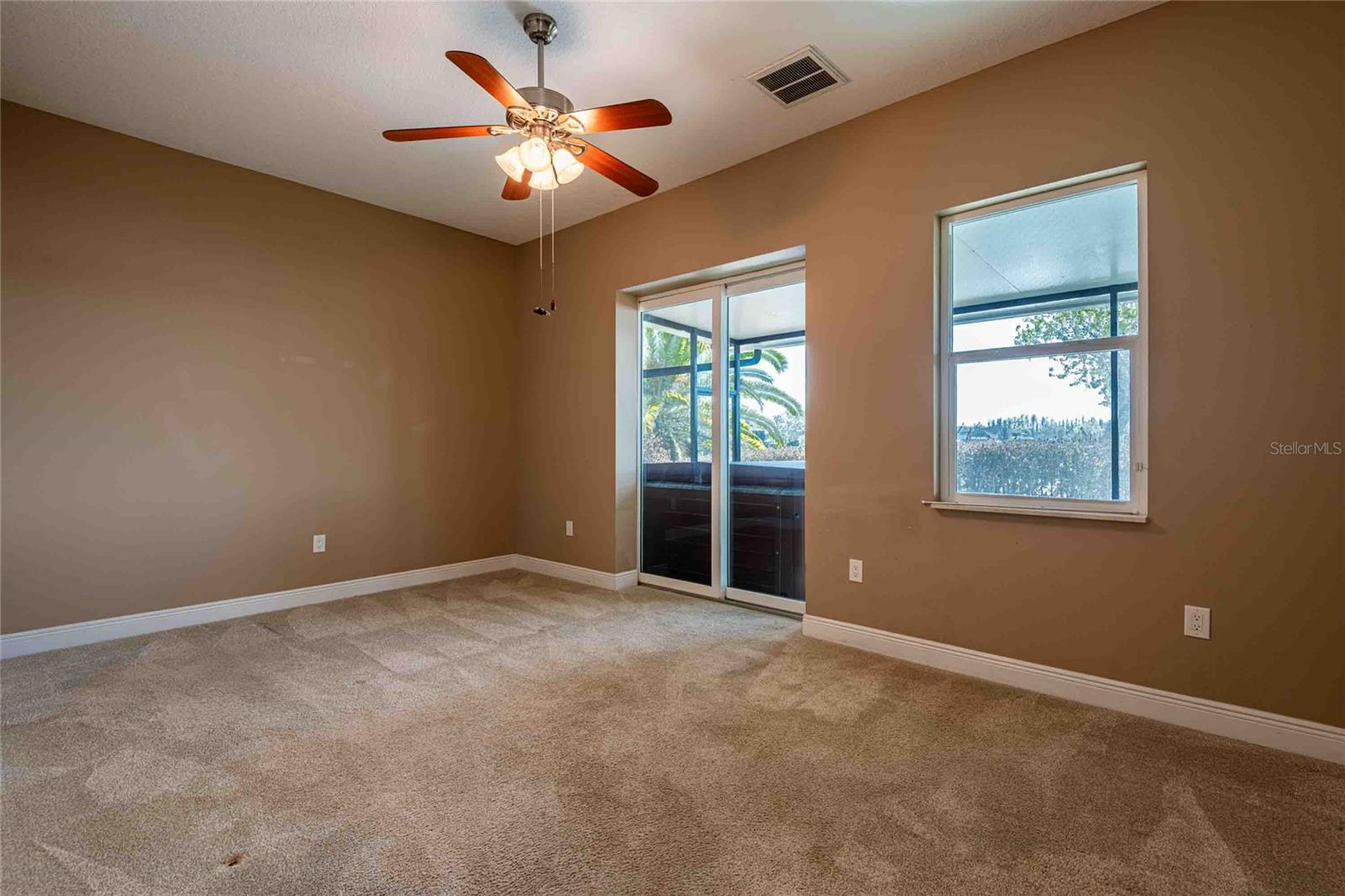Bedroom with sliding doors to lanai